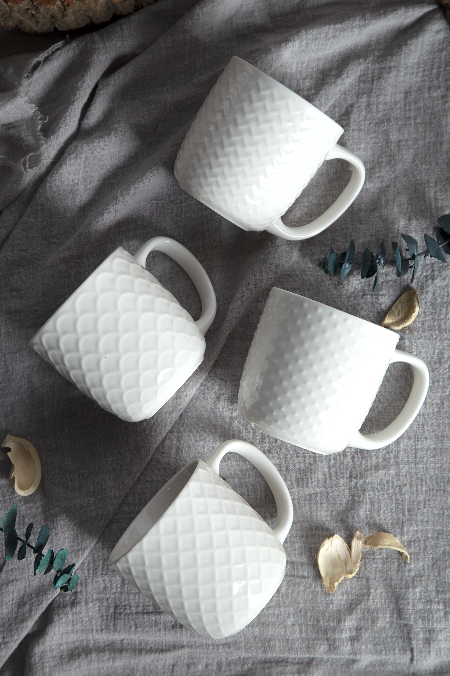 CHANGSHA HAPPY GO White Embossed Bone China Mugs – Glossy Color Glaze with 3D Relief Texture |happygodinnerware.com