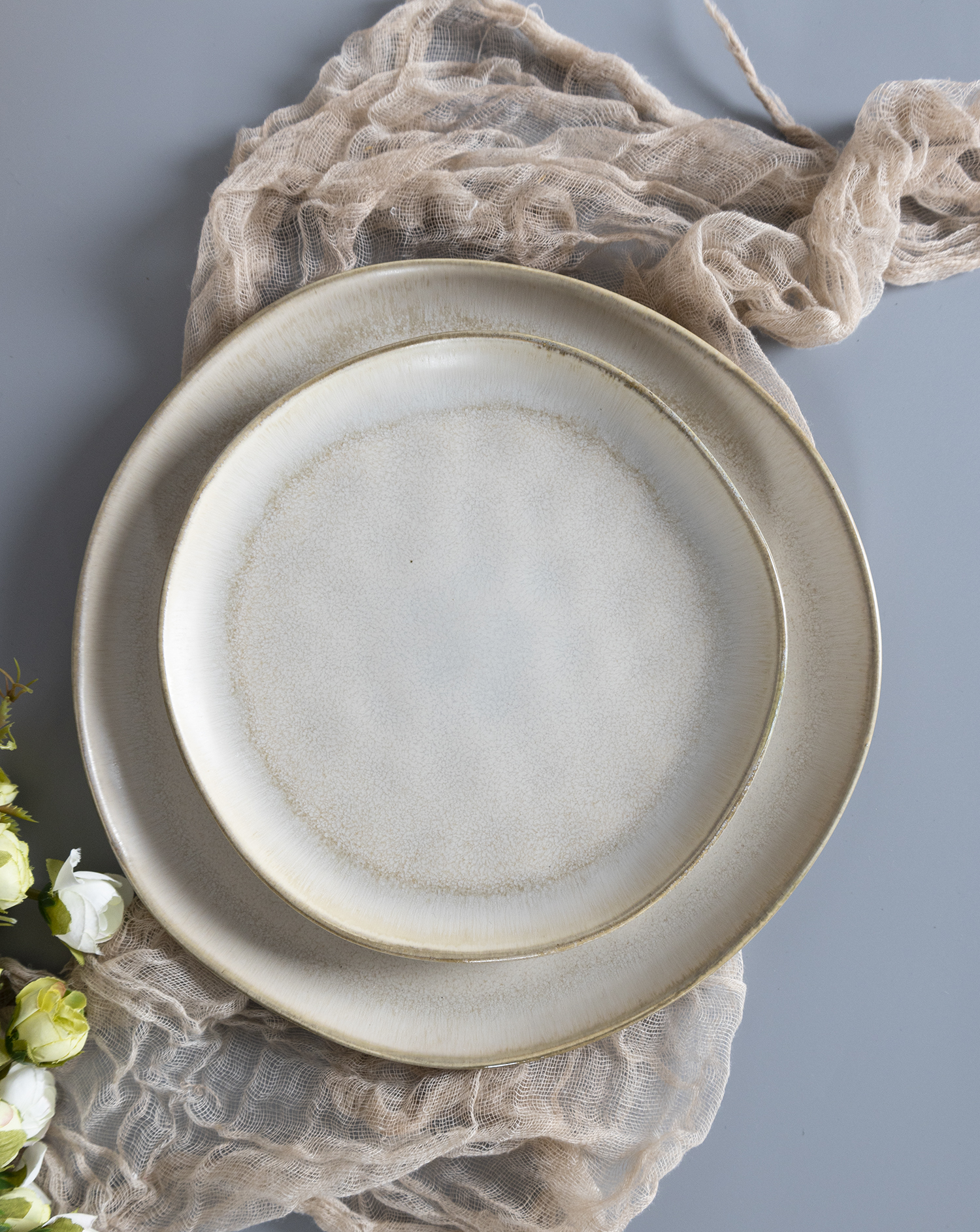​CHANGSHA HAPPY GO  Soft Ivory Beige Stoneware Dining Set with Subtle Reactive Glaze and Rustic Charm |happygodinnerware.com