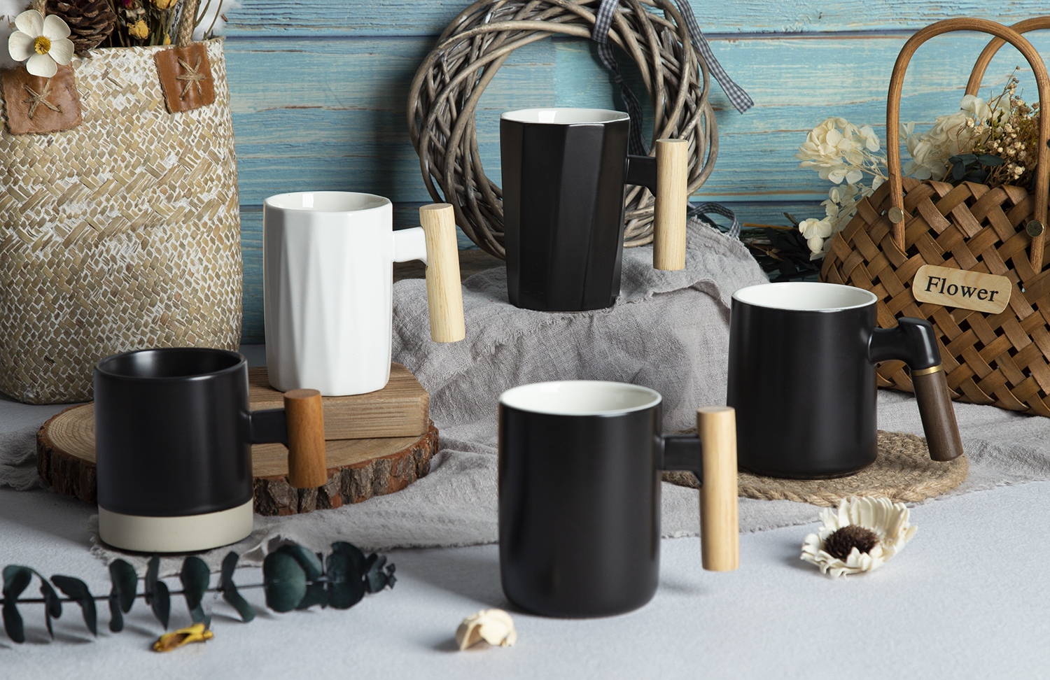 CHANGSHA HAPPY GO Stoneware Embossed & Colored Glaze Craft Mugs with Wooden Handles |happygodinnerware.com