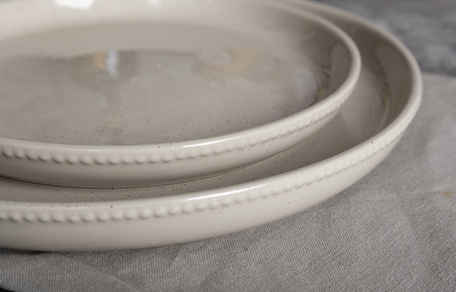 CHANGSHA HAPPY GO  Dot Embossed Reactive Glaze Stoneware Dinner Set in Light Gray with Textured Detail  |happygodinnerware.com
