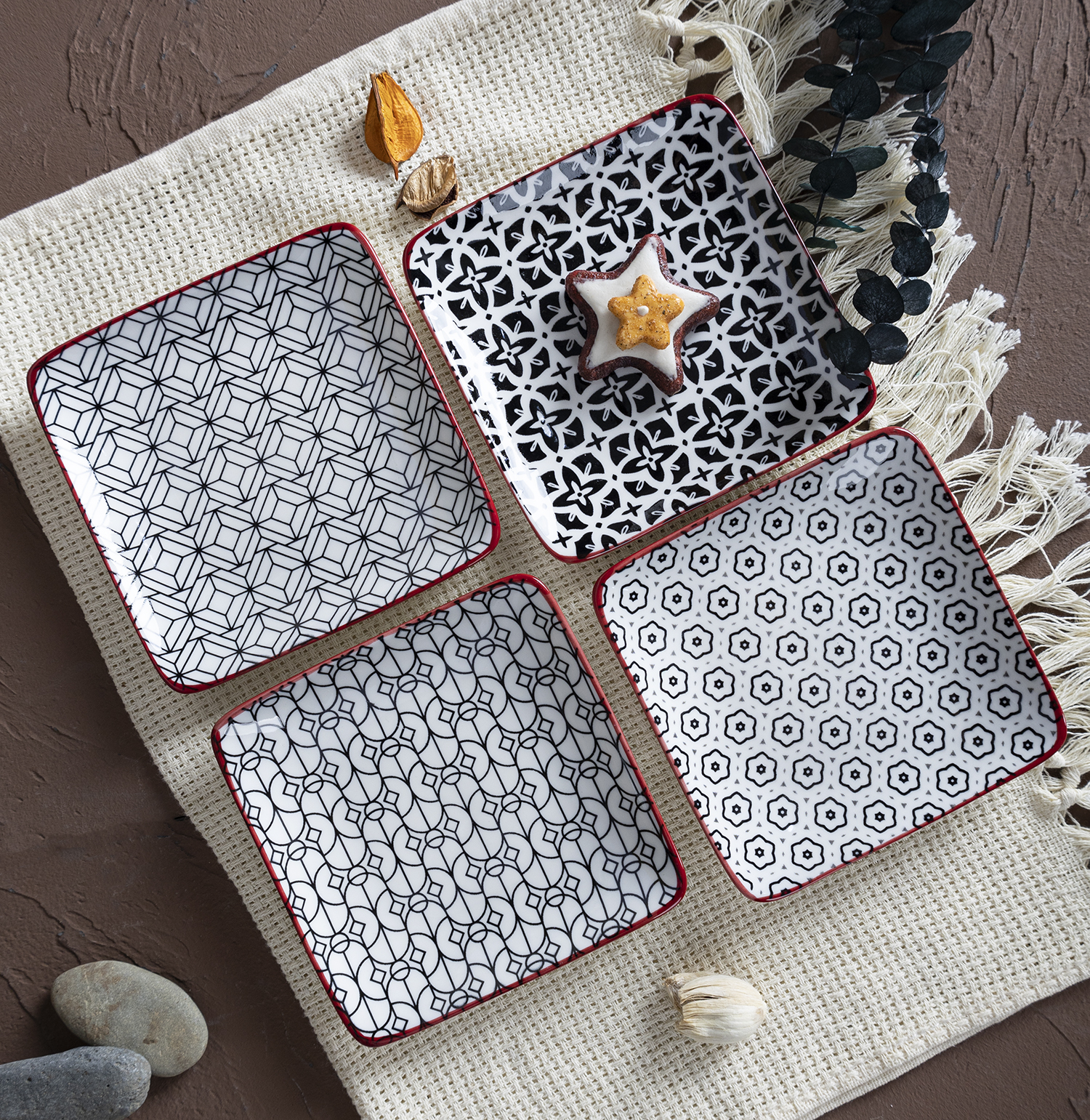 CHANGSHA HAPPY GO  Stylish Black and White Porcelain Dinnerware Set with Red Rim and Artistic Patterns  |happygodinnerware.com