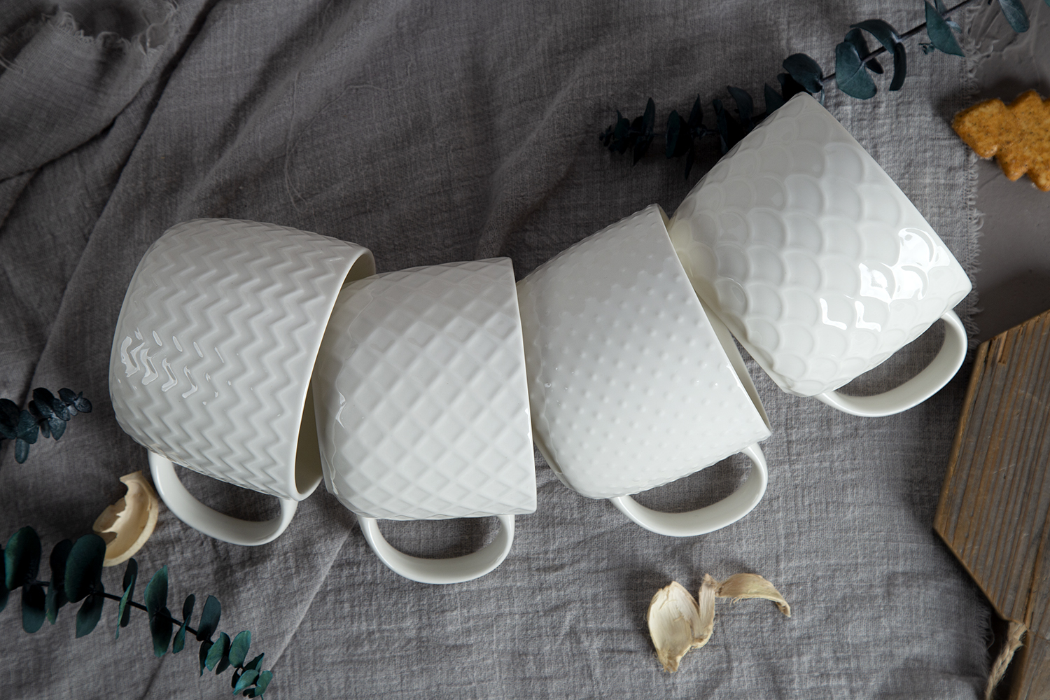 CHANGSHA HAPPY GO White Embossed Bone China Mugs – Glossy Color Glaze with 3D Relief Texture |happygodinnerware.com